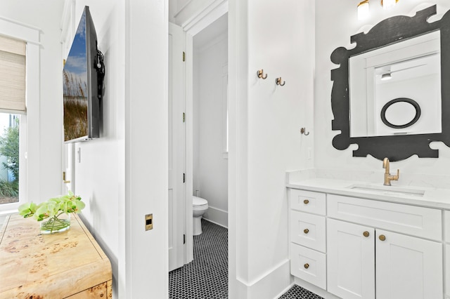 bathroom featuring vanity and toilet