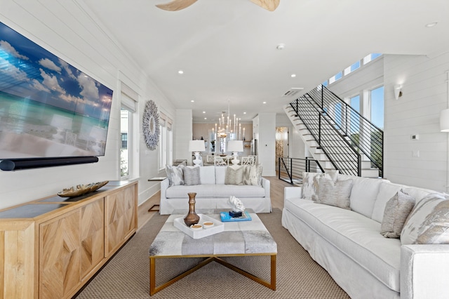 living room featuring light carpet and plenty of natural light