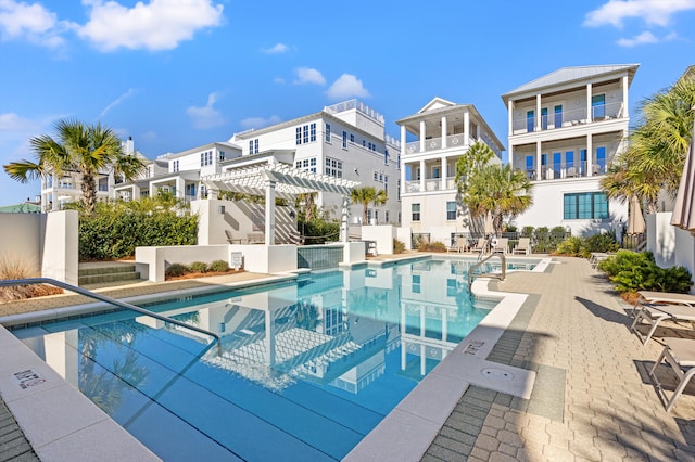 view of pool with a patio area and a pergola