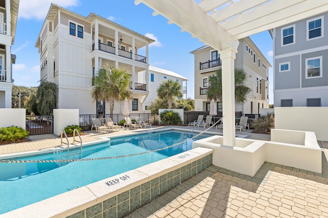 view of pool with a pergola and a patio