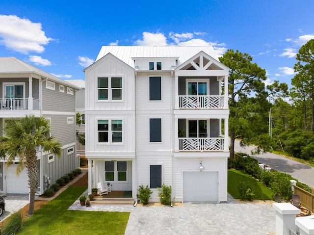 view of front of property with a front yard and a garage