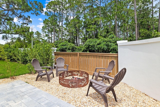 view of patio / terrace with an outdoor fire pit