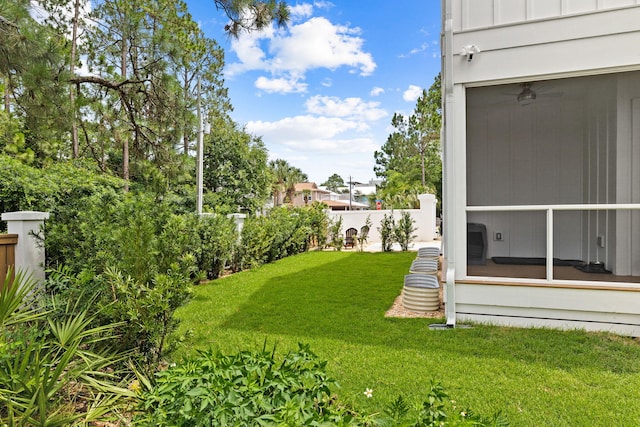 view of yard featuring a sunroom