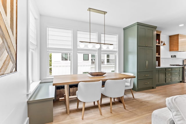 dining room with breakfast area and light hardwood / wood-style flooring