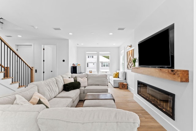 living room with light hardwood / wood-style flooring