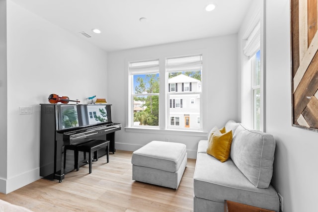 living area with light hardwood / wood-style floors