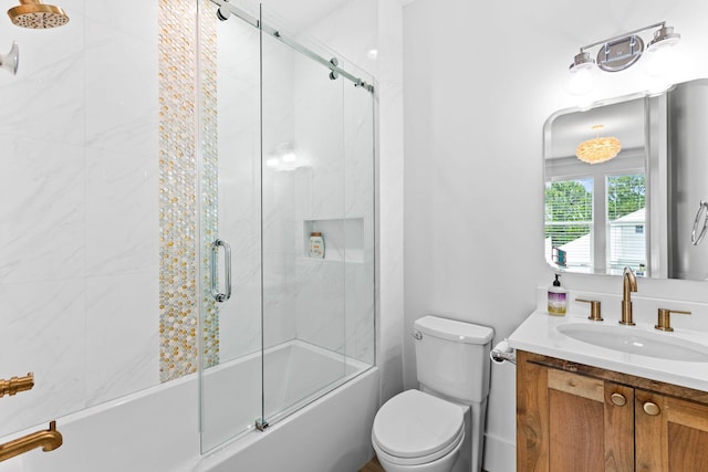 full bathroom featuring vanity, toilet, and enclosed tub / shower combo