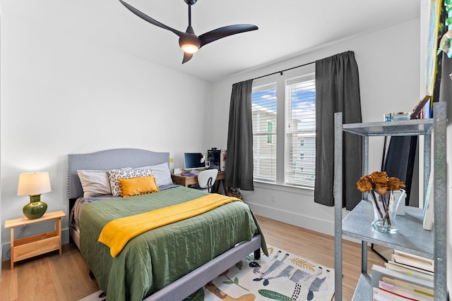 bedroom with hardwood / wood-style flooring and ceiling fan