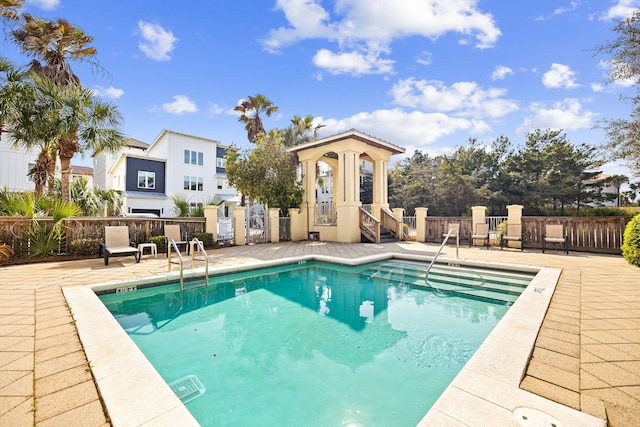 view of swimming pool with a patio area