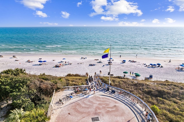 aerial view with a beach view and a water view