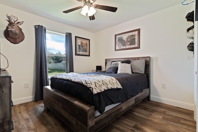 bedroom featuring ceiling fan and dark wood-type flooring