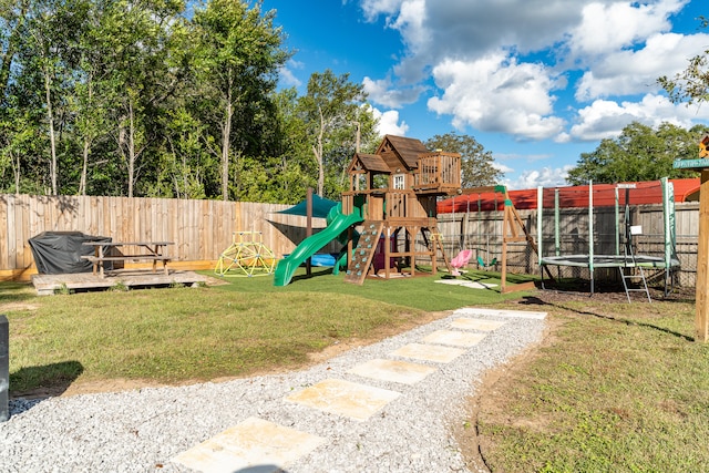 view of playground with a trampoline and a yard