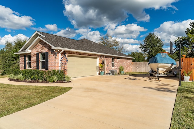 view of front of home with a garage and a front lawn