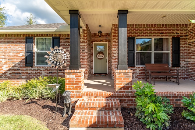 doorway to property with covered porch