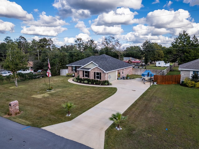 view of front of home featuring a front yard and a garage