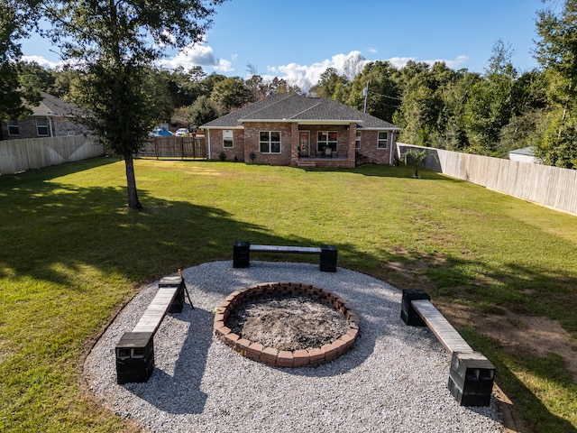 view of yard with a fire pit