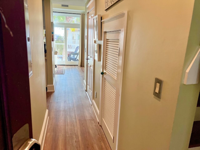 hall with light hardwood / wood-style floors