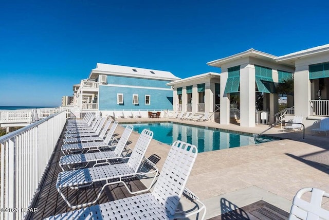 view of swimming pool featuring a patio