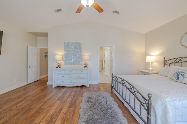 bedroom featuring hardwood / wood-style flooring, ceiling fan, and lofted ceiling