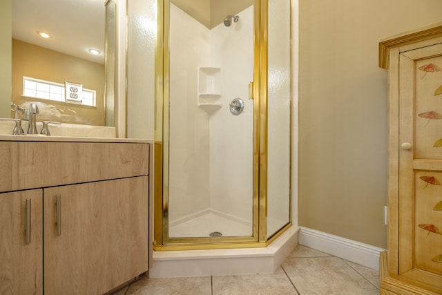 bathroom with tile patterned flooring, vanity, and an enclosed shower