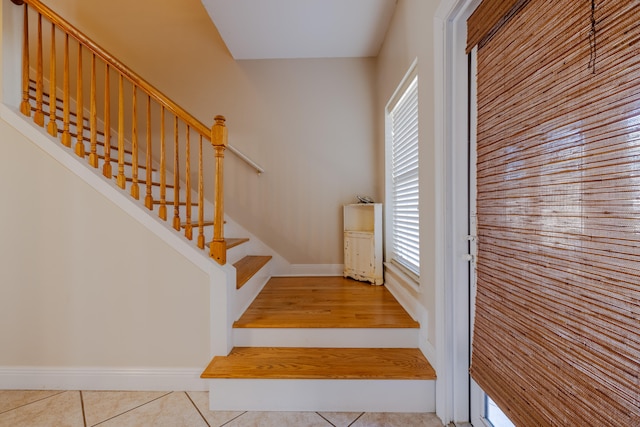 stairway featuring tile patterned floors