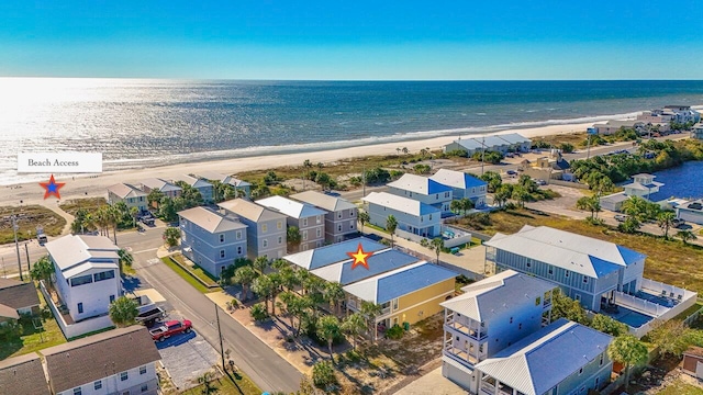 aerial view featuring a view of the beach and a water view