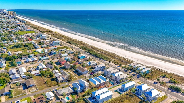 bird's eye view featuring a water view and a view of the beach