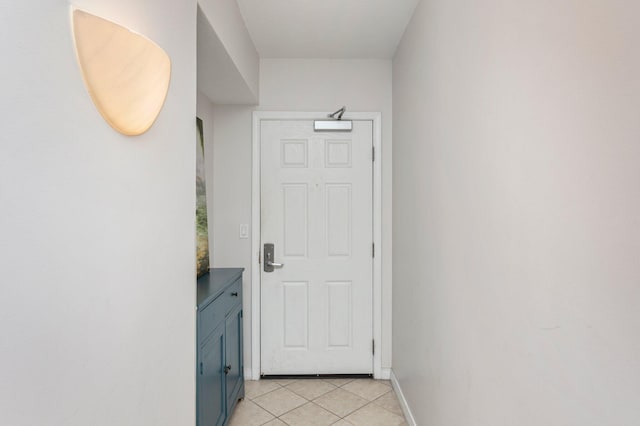 doorway featuring light tile patterned flooring