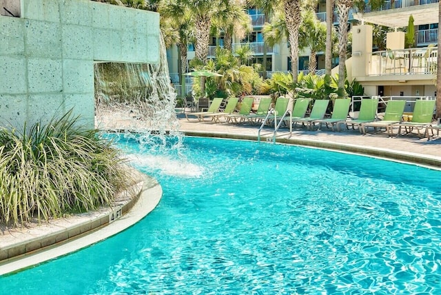 view of pool featuring pool water feature