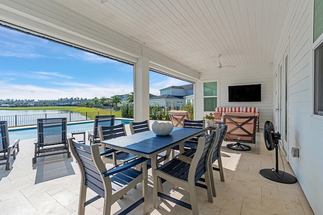 view of patio with a water view