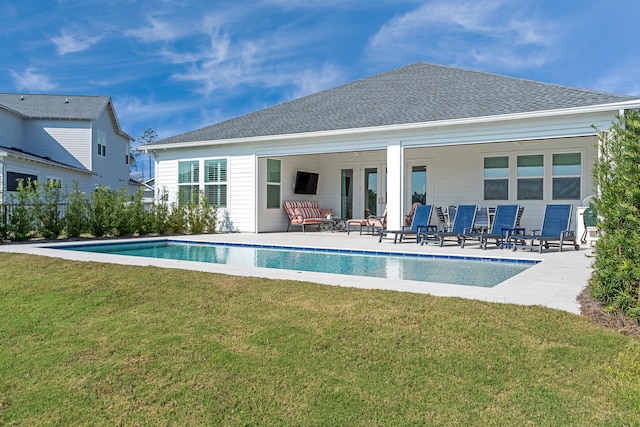 rear view of house featuring a yard, an outdoor hangout area, and a patio area