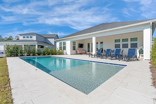 view of swimming pool with a patio area