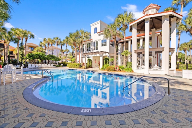 view of swimming pool with a patio area