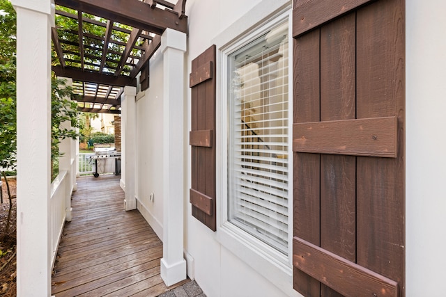 doorway to property with a pergola