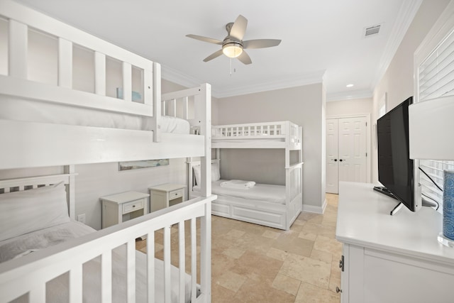 bedroom featuring a closet, ceiling fan, and crown molding