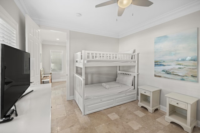 bedroom featuring multiple windows, ceiling fan, and crown molding