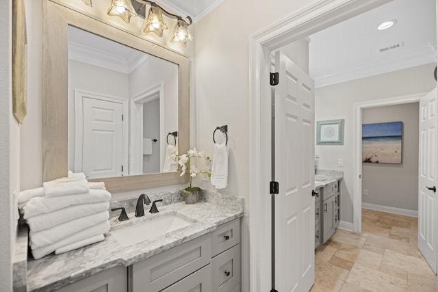 bathroom with vanity and ornamental molding