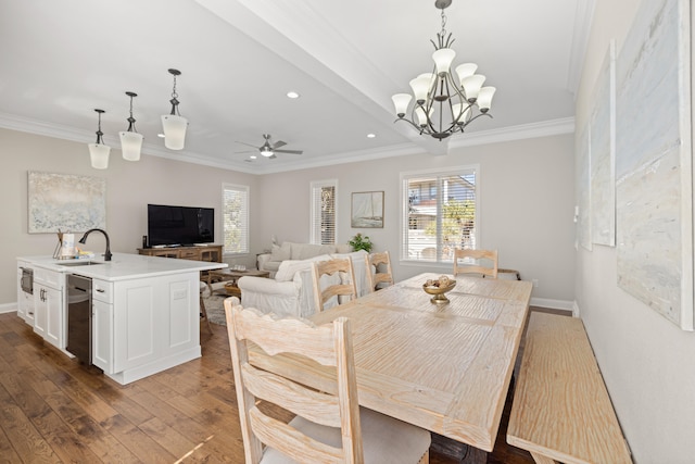 dining area featuring crown molding, sink, ceiling fan with notable chandelier, and dark hardwood / wood-style floors