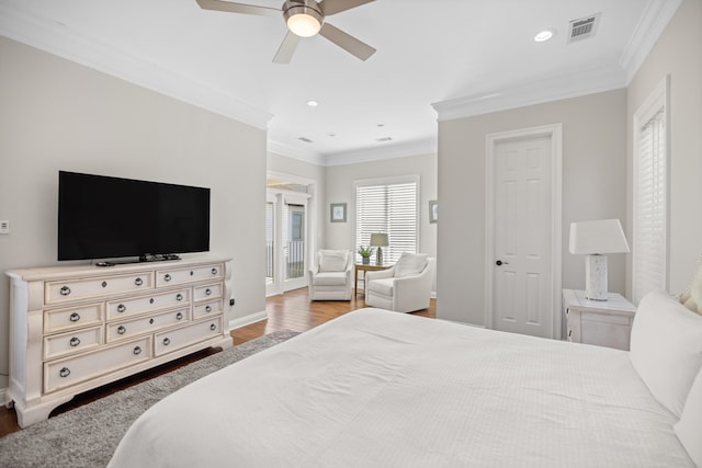 bedroom featuring ceiling fan, ornamental molding, and hardwood / wood-style flooring