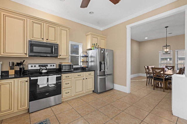 kitchen featuring cream cabinetry, light tile patterned floors, ceiling fan with notable chandelier, and stainless steel appliances