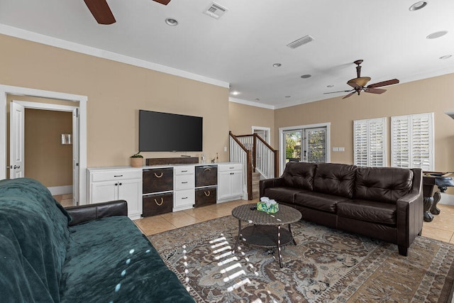 living room with light tile patterned floors and ornamental molding