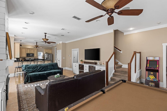 tiled living room with ornamental molding and billiards