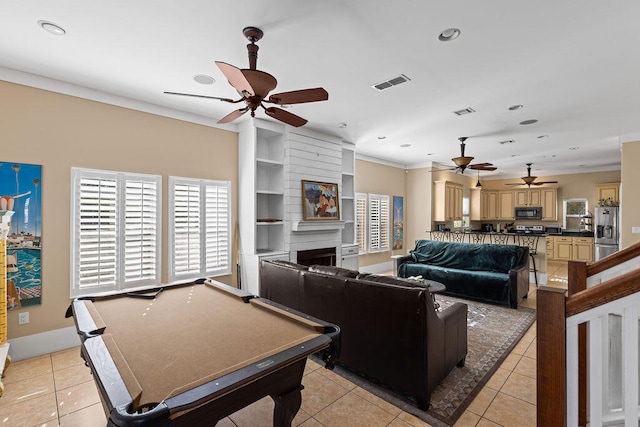 playroom featuring built in shelves, ceiling fan, light tile patterned floors, billiards, and a fireplace