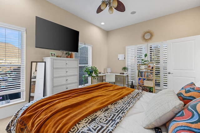 carpeted bedroom featuring ceiling fan