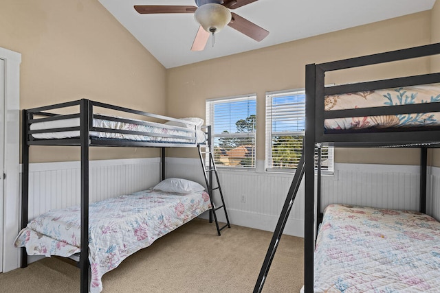 bedroom with carpet floors, ceiling fan, and lofted ceiling