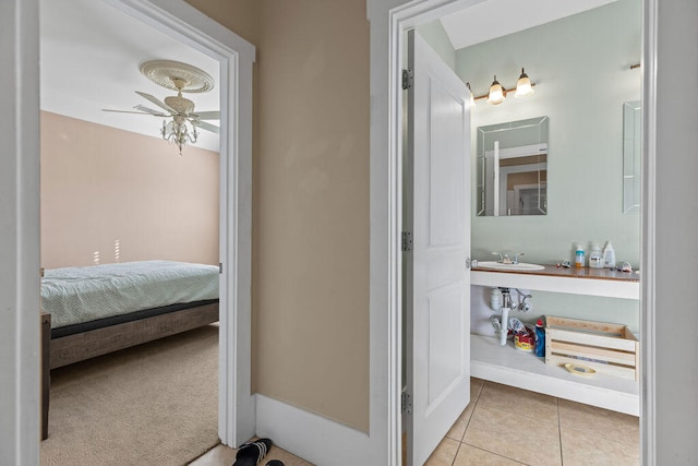 bathroom featuring tile patterned floors, ceiling fan, and sink