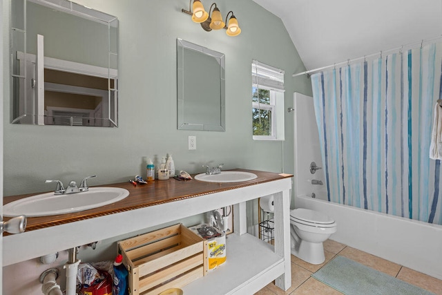 full bathroom with tile patterned flooring, shower / bath combo, vaulted ceiling, and sink