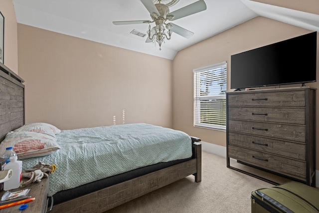 bedroom featuring ceiling fan, light colored carpet, and vaulted ceiling