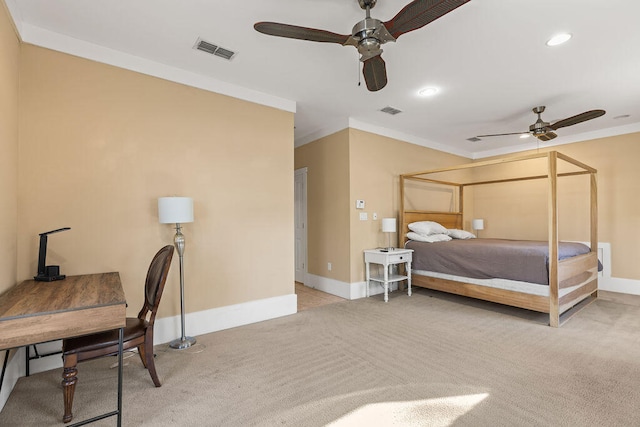 carpeted bedroom featuring ceiling fan and ornamental molding