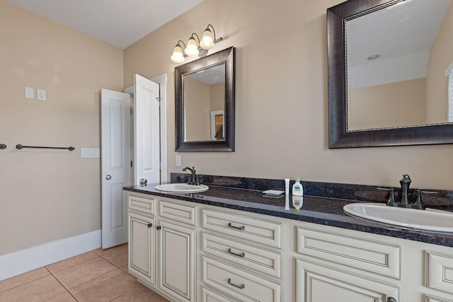 bathroom with tile patterned floors and vanity